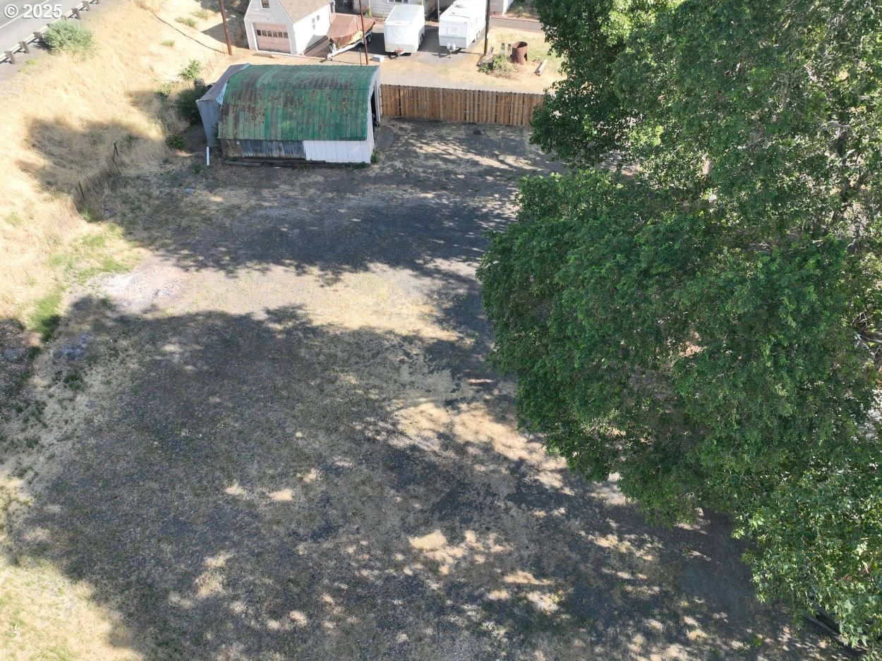 West 2nd Street The Dalles, OR 97058 - Photo 9 of 31 a view of a yard with large trees