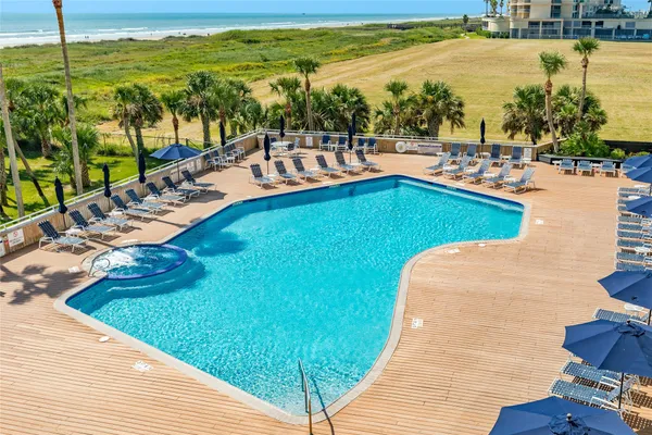 a view of a swimming pool with an ocean view