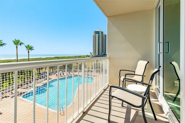 a view of a balcony with chairs