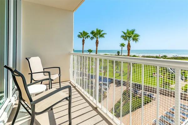 a view of a balcony with wooden floor