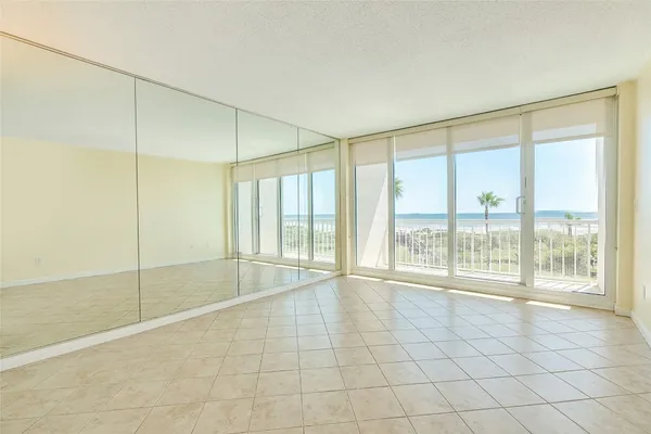 a view of an empty room with glass door