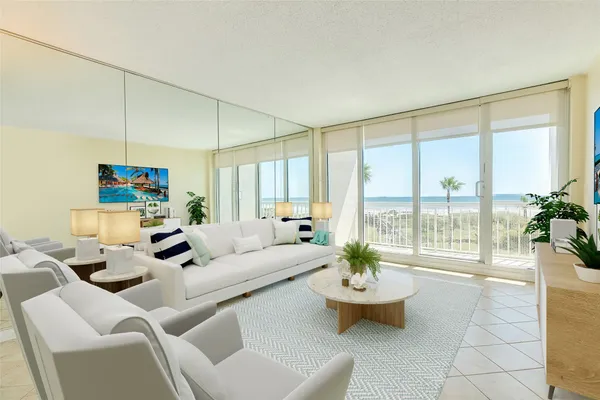 a living room with furniture and a large window