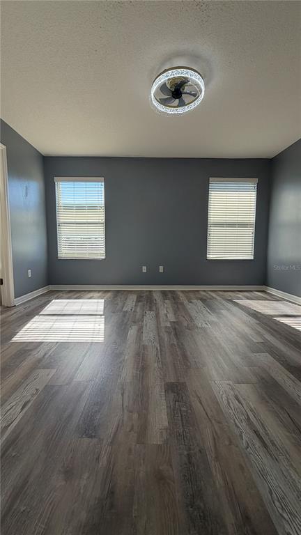 1941 Brancaster Circle Ocoee, FL 34761 - Photo 14 of 33 an empty room with wooden floor and windows