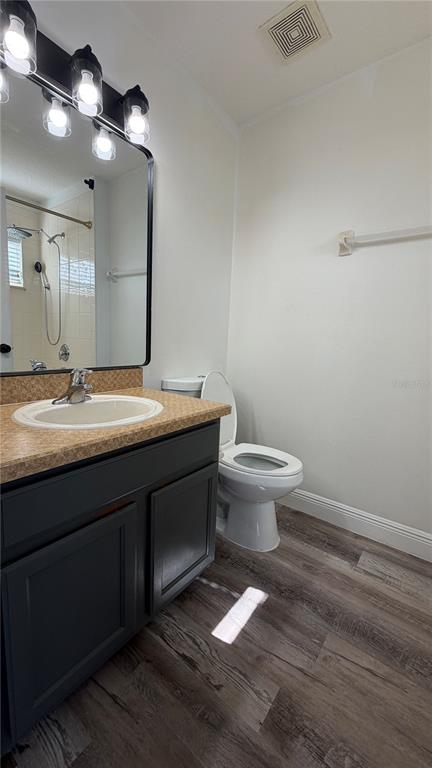 1941 Brancaster Circle Ocoee, FL 34761 - Photo 16 of 33 a bathroom with a sink and a toilet