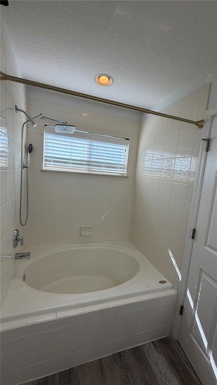 1941 Brancaster Circle Ocoee, FL 34761 - Photo 17 of 33 a white bath tub sitting next to a shower