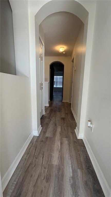 1941 Brancaster Circle Ocoee, FL 34761 - Photo 18 of 33 a view of a hallway with wooden floor