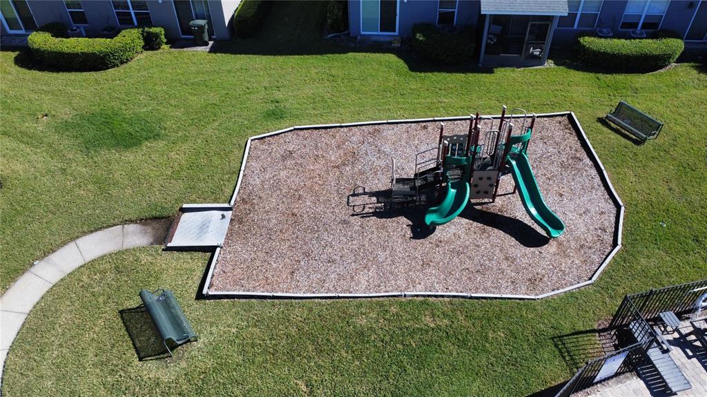 1941 Brancaster Circle Ocoee, FL 34761 - Photo 30 of 33 swimming pool view with a garden and outdoor seating