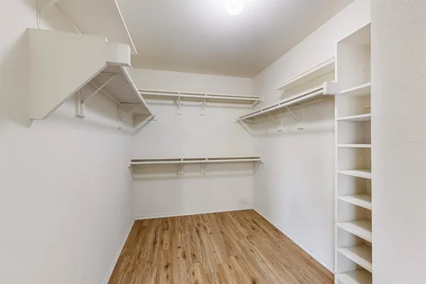 a view of an empty walk in closet