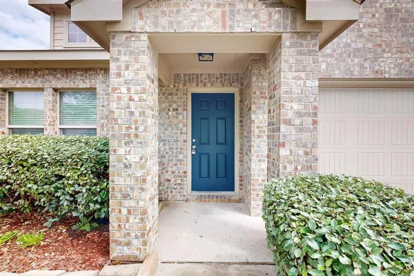 a front view of a house with a garage