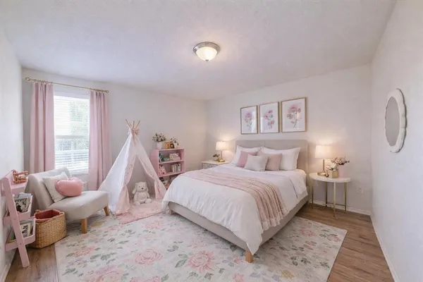 a bedroom with a bed and a couch