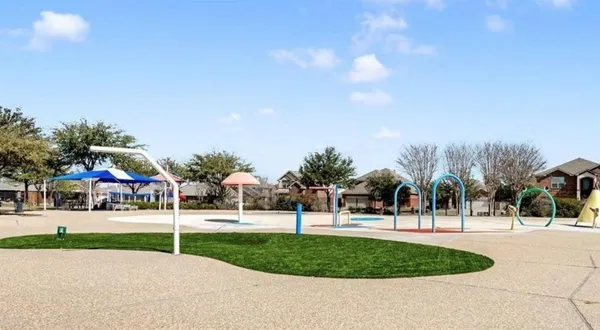 a view of a park with swings