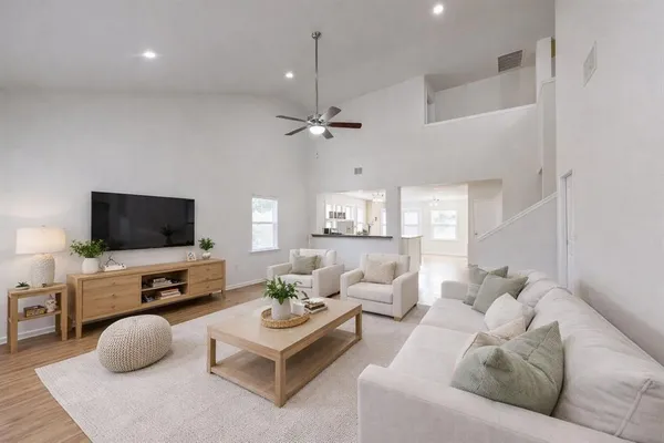 a living room with furniture and a flat screen tv