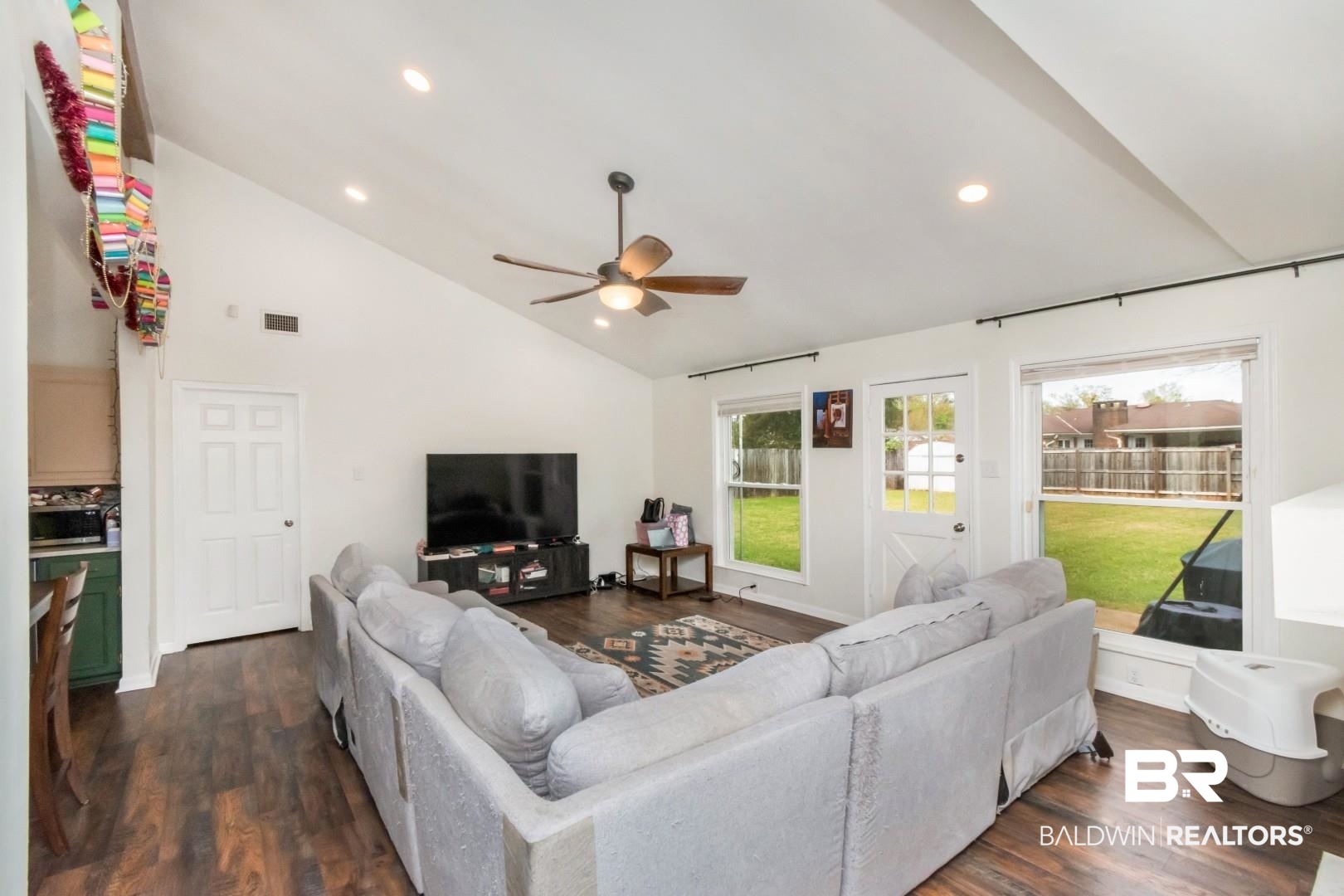 6208 Cottage Hill Road Mobile, AL 36609 - Photo 5 of 20 Living area with lofted ceiling, dark wood-style flooring, recessed lighting, and ceiling fan