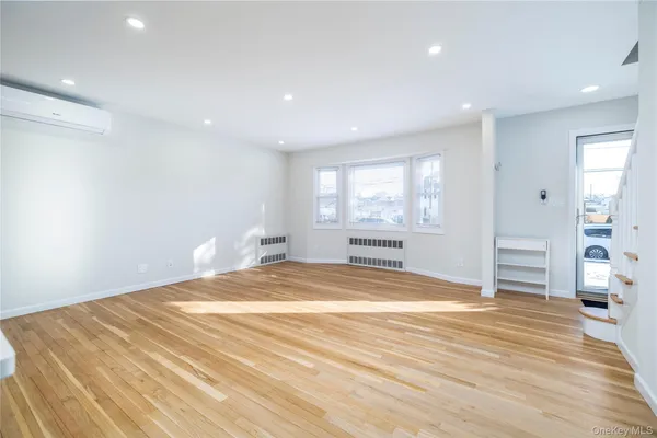 a view of a kitchen and kitchen counter top space with wooden floor