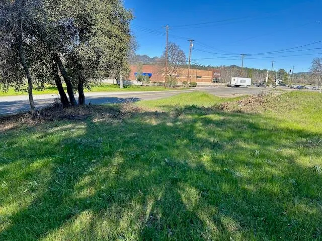 a view of a yard with a house and a play ground