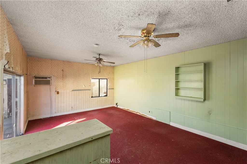 9044 Oak Street Bellflower, CA 90706 - Photo 17 of 30 a bedroom with a bed and a chandelier fan