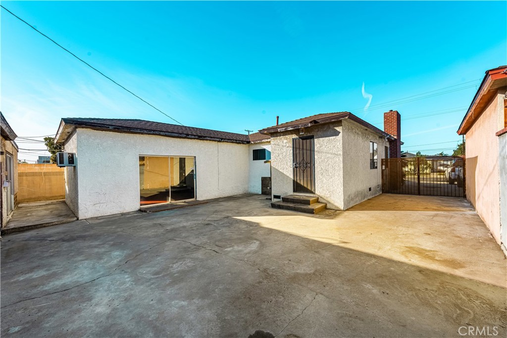 9044 Oak Street Bellflower, CA 90706 - Photo 20 of 30 a view of a house with backyard