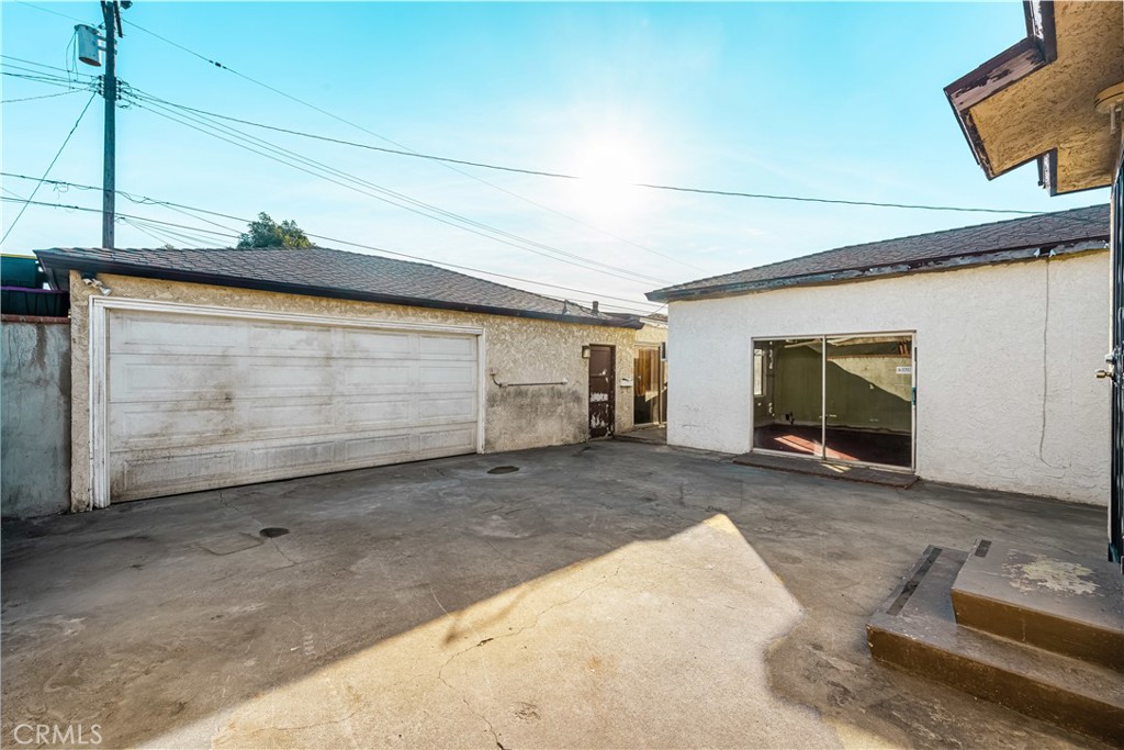 9044 Oak Street Bellflower, CA 90706 - Photo 21 of 30 a view of a house with garage