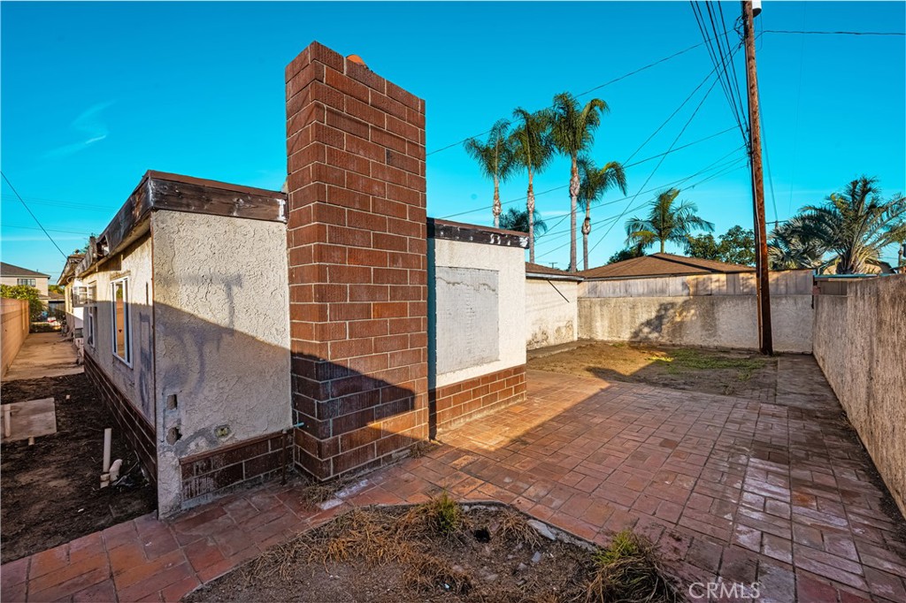 9044 Oak Street Bellflower, CA 90706 - Photo 28 of 30 a view of a house with a yard