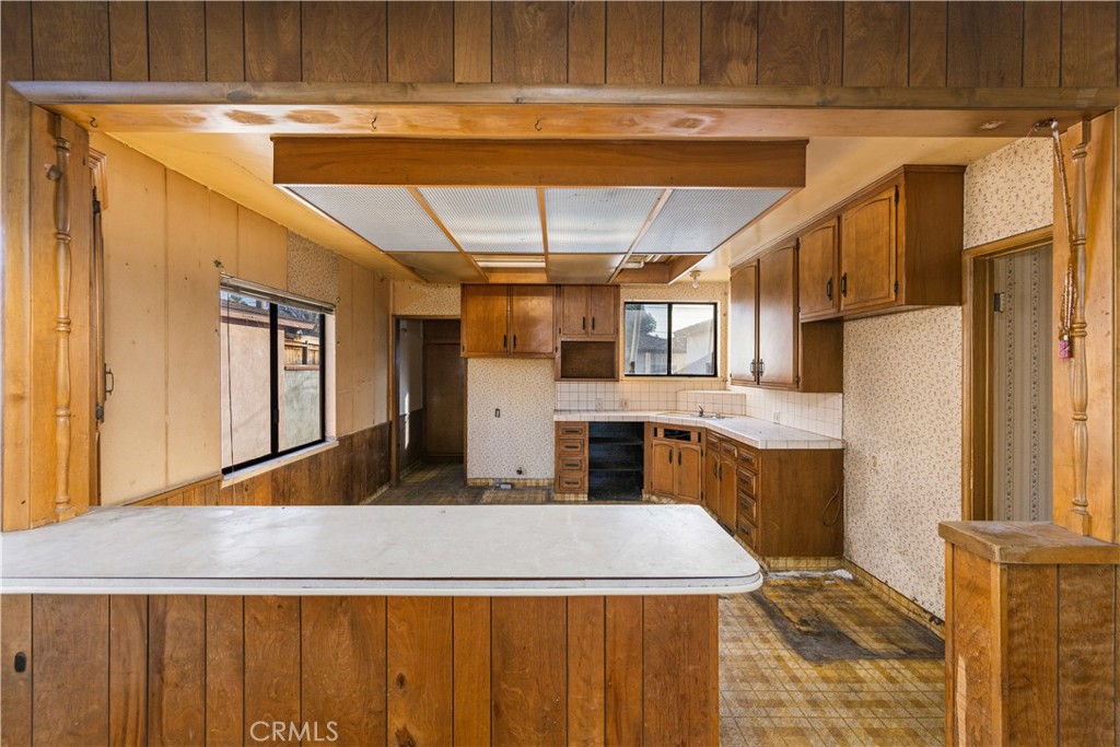9044 Oak Street Bellflower, CA 90706 - Photo 6 of 30 a view of kitchen with furniture and wooden floor