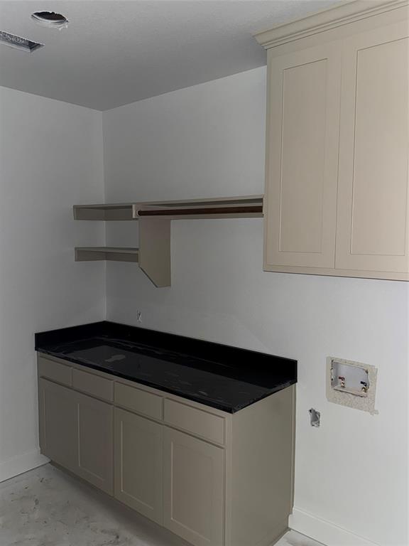 113 County Road 359 Muenster, TX 76252 - Photo 5 of 15 a close view of a utility room with washer and dryer