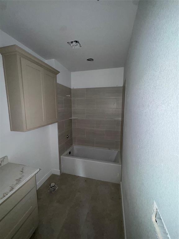 113 County Road 359 Muenster, TX 76252 - Photo 7 of 15 a bathroom with a bathtub sink and vanity