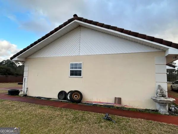 a house with trees in the background
