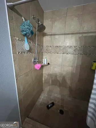 a bathroom with a sink toilet and mirror