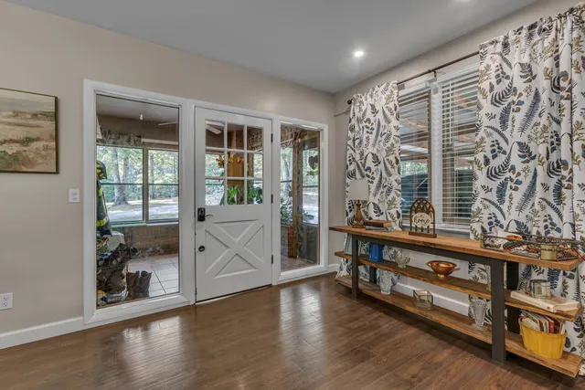 a bathroom with a double vanity sink mirror and shower