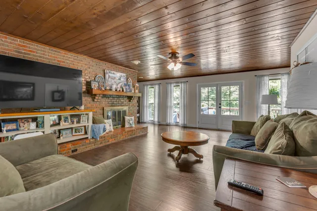 a kitchen with a refrigerator and a sink