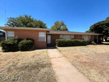 a view of a backyard of the house