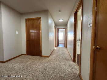 8302 Interstate 27 Lubbock, TX 79423 - Photo 15 of 21 an empty room with closet and mirror