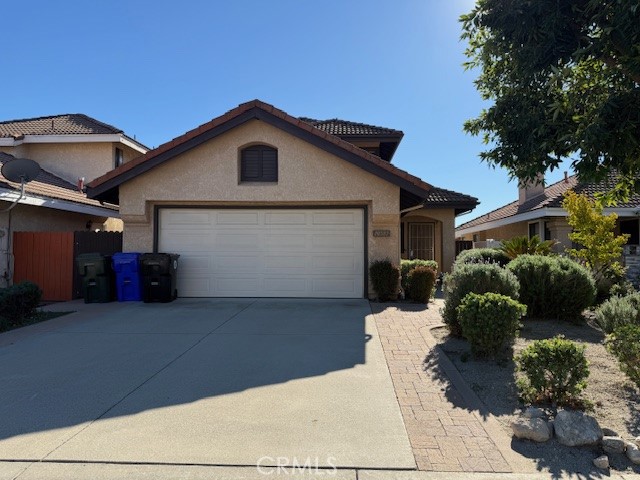 10581 Sunburst Drive Rancho Cucamonga, CA 91730 - Photo 2 of 19 a view of a house with a yard and potted plants