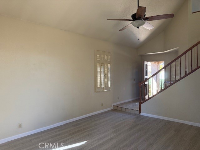 10581 Sunburst Drive Rancho Cucamonga, CA 91730 - Photo 4 of 19 an empty room with wooden floor fan and windows