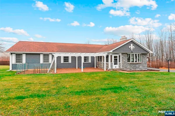 a view of a house with a big yard