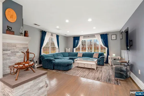 a living room with furniture and a flat screen tv