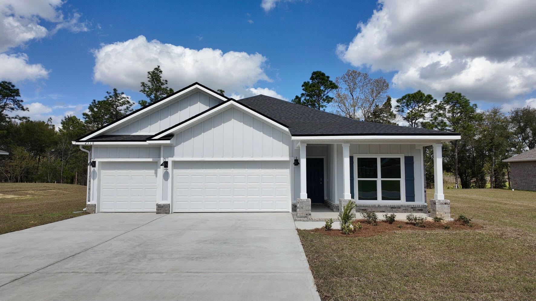 front view of a house with a yard