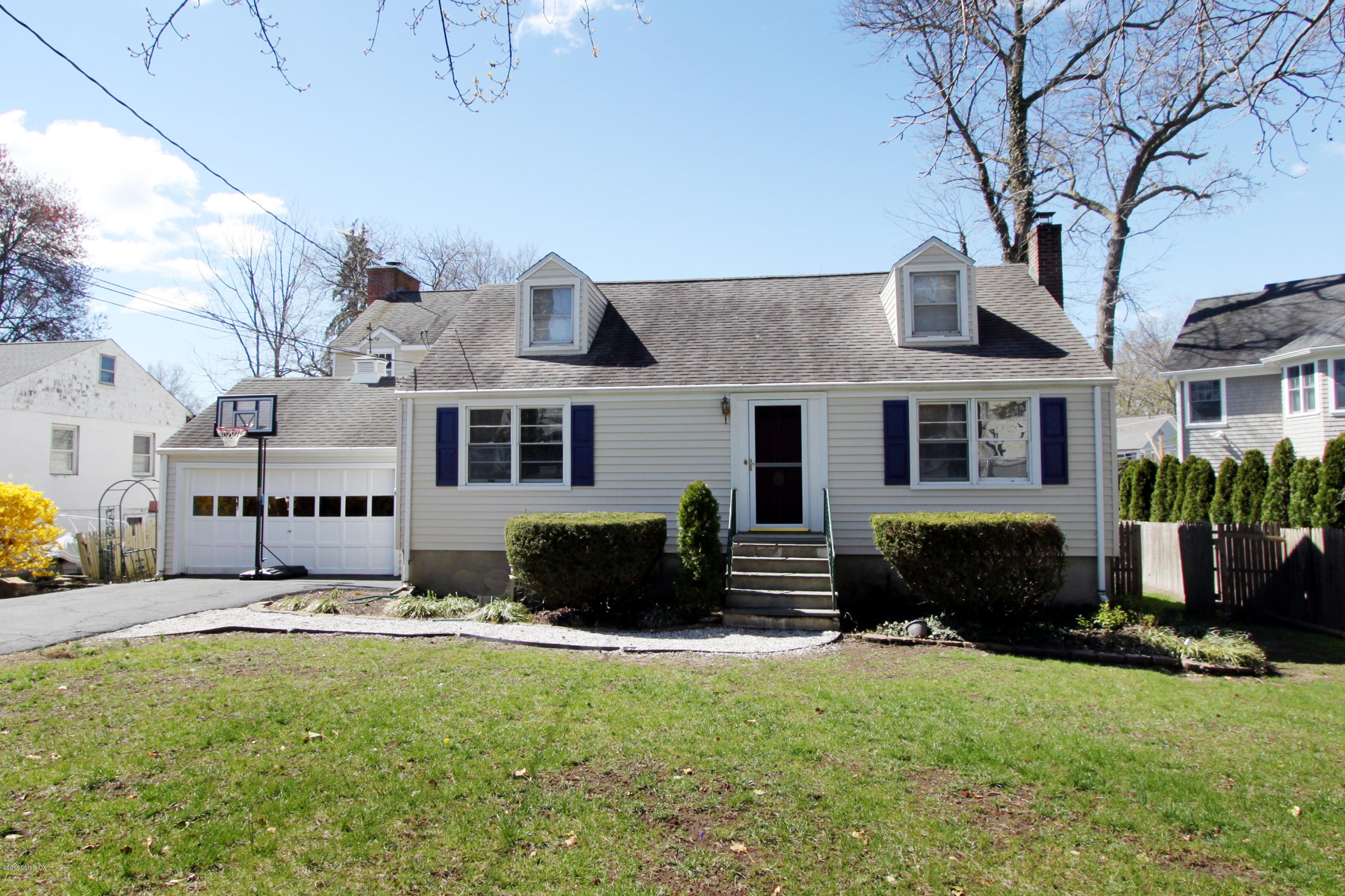 26 Thorn Hill Road Riverside, CT 06878 - Photo 1 of 14 a front view of a house with a yard