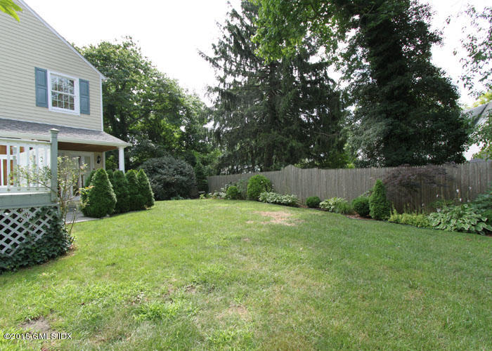 26 Thorn Hill Road Riverside, CT 06878 - Photo 13 of 14 a view of a backyard with plants and large trees