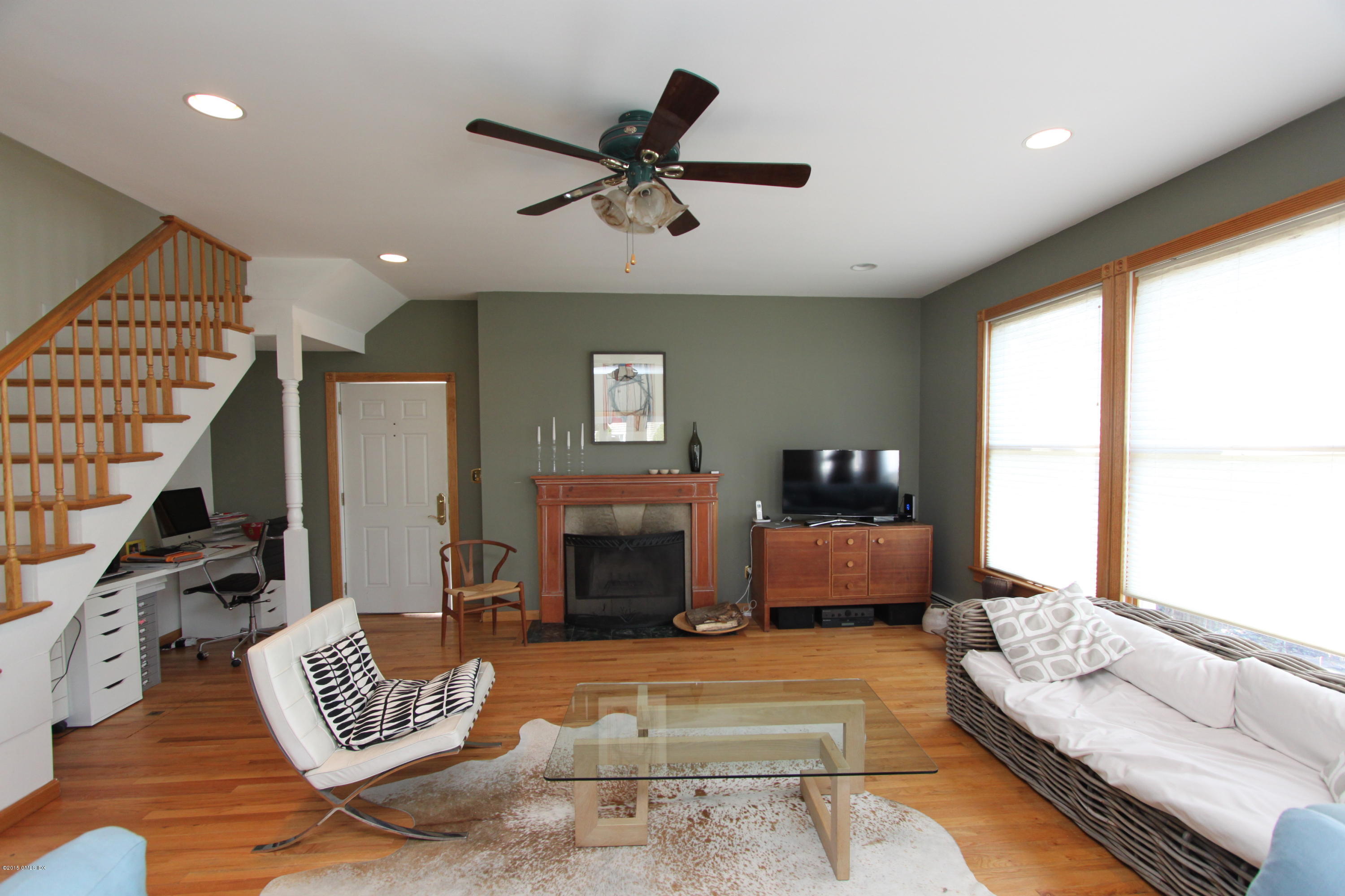 26 Thorn Hill Road Riverside, CT 06878 - Photo 2 of 14 a living room with furniture and a fireplace