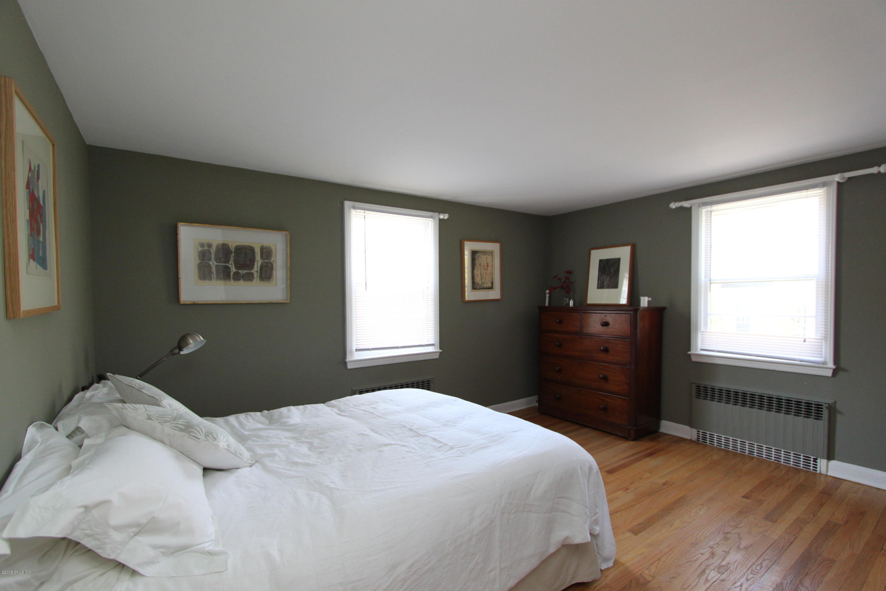 26 Thorn Hill Road Riverside, CT 06878 - Photo 5 of 14 a bedroom with a bed dresser and a window