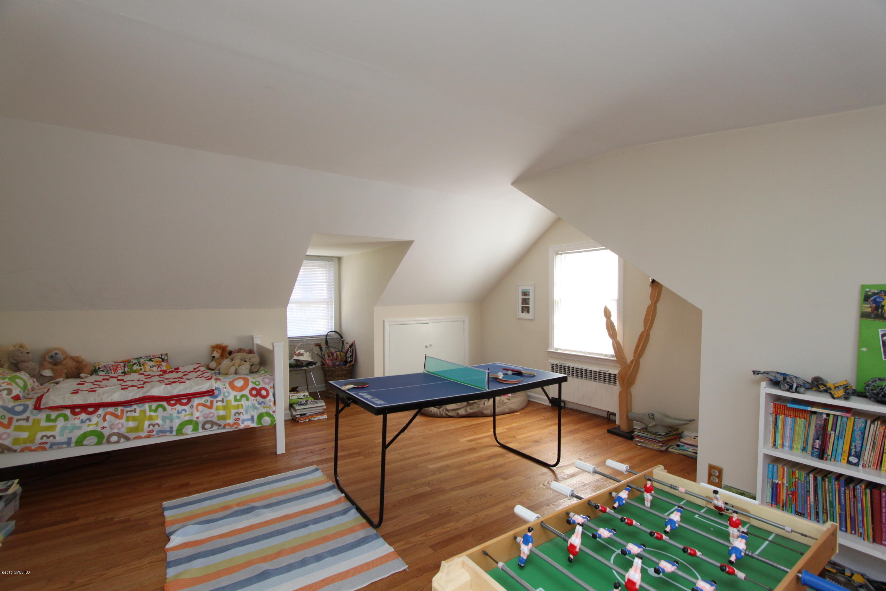 26 Thorn Hill Road Riverside, CT 06878 - Photo 10 of 14 a bedroom with furniture and a book shelf