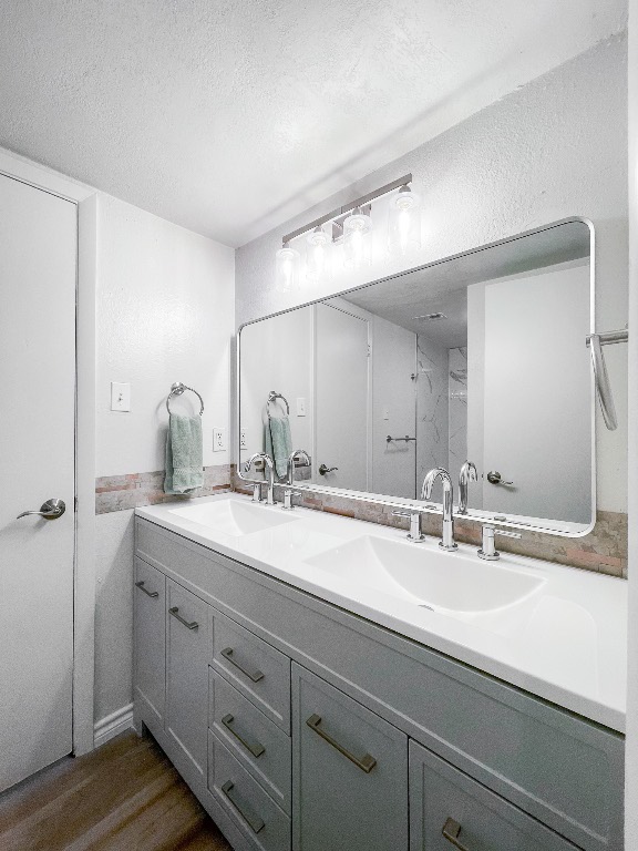2401 Bucks Run, Unit A Austin, TX 78744 - Photo 28 of 33 a bathroom with a sink and a mirror