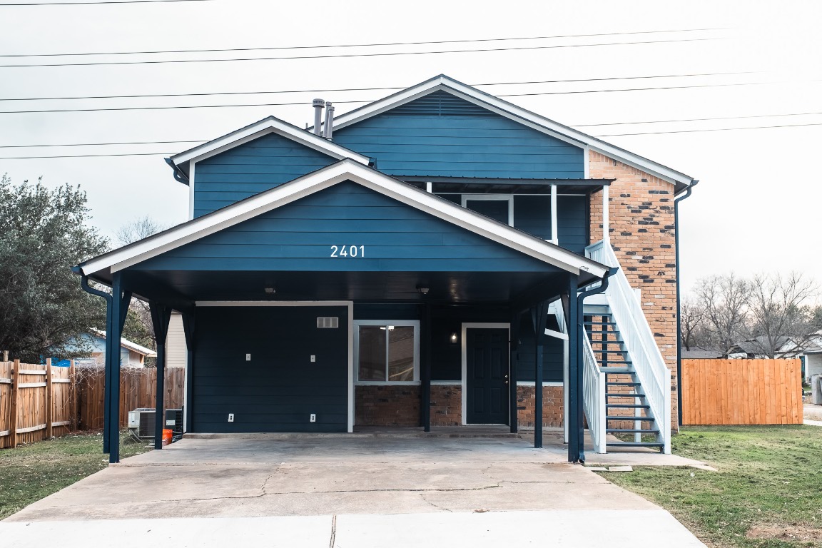 2401 Bucks Run, Unit A Austin, TX 78744 - Photo 7 of 33 a front view of a house with a yard