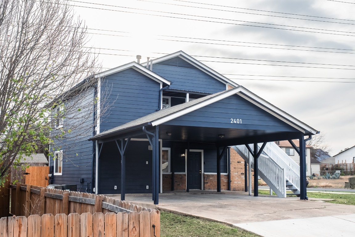2401 Bucks Run, Unit A Austin, TX 78744 - Photo 9 of 33 View of front facade with stairway and concrete driveway