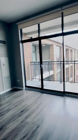 a view of a large window with wooden floor