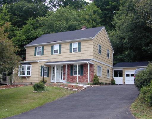 121 Shadow Ridge Road Stamford, CT 06905 - Photo 1 of 1 front view of a house with a yard