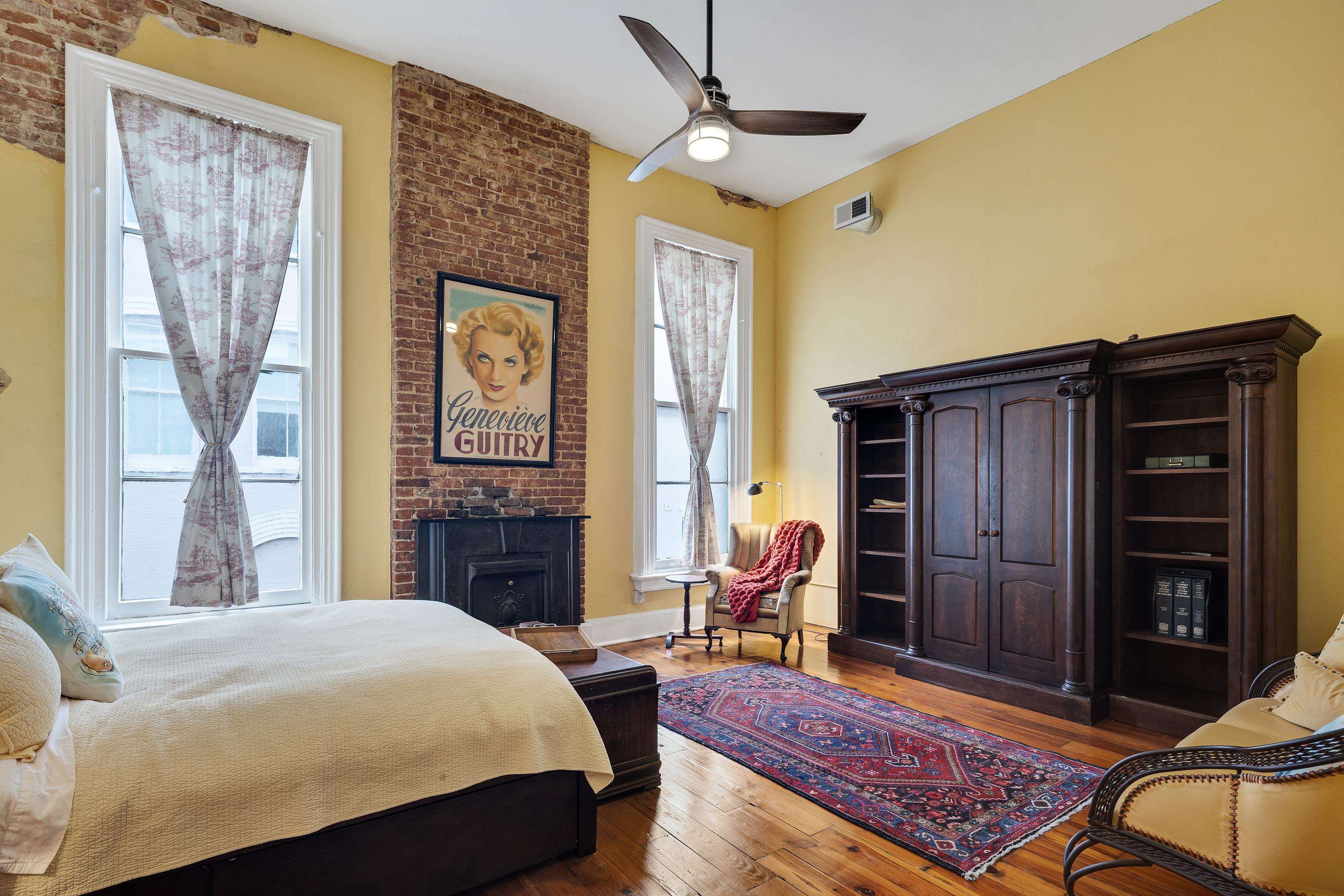 116 South Front Street, Unit 201 Memphis, TN 38103 - Photo 13 of 26 a bedroom with a bed dresser and a window
