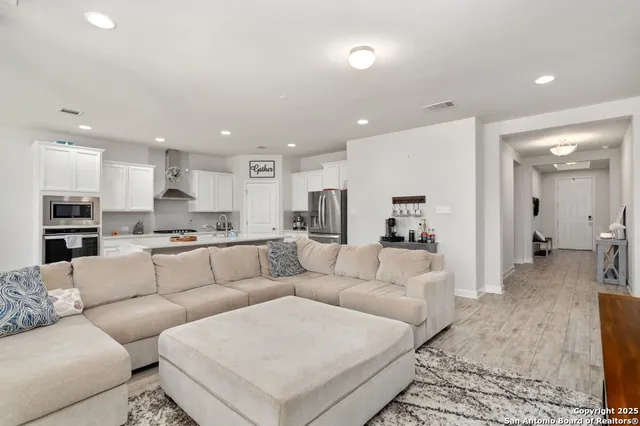 a living room with furniture and a view of living room