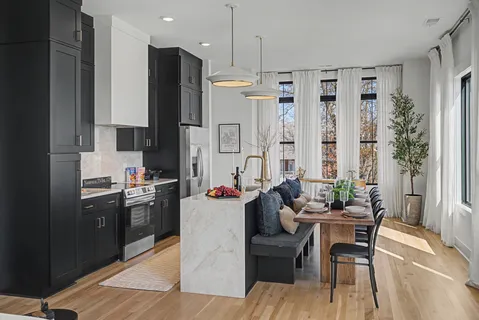 a view of a dining room with furniture window and wooden floor